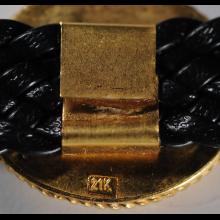 Bracelet or et cuir avec pice en bronze
